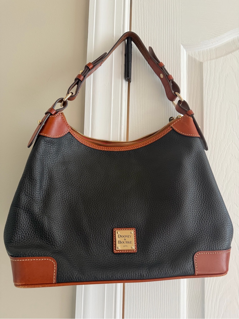 Dooney & Bourke Black Pebbled Leather Shoulder Bag with Brown Trim